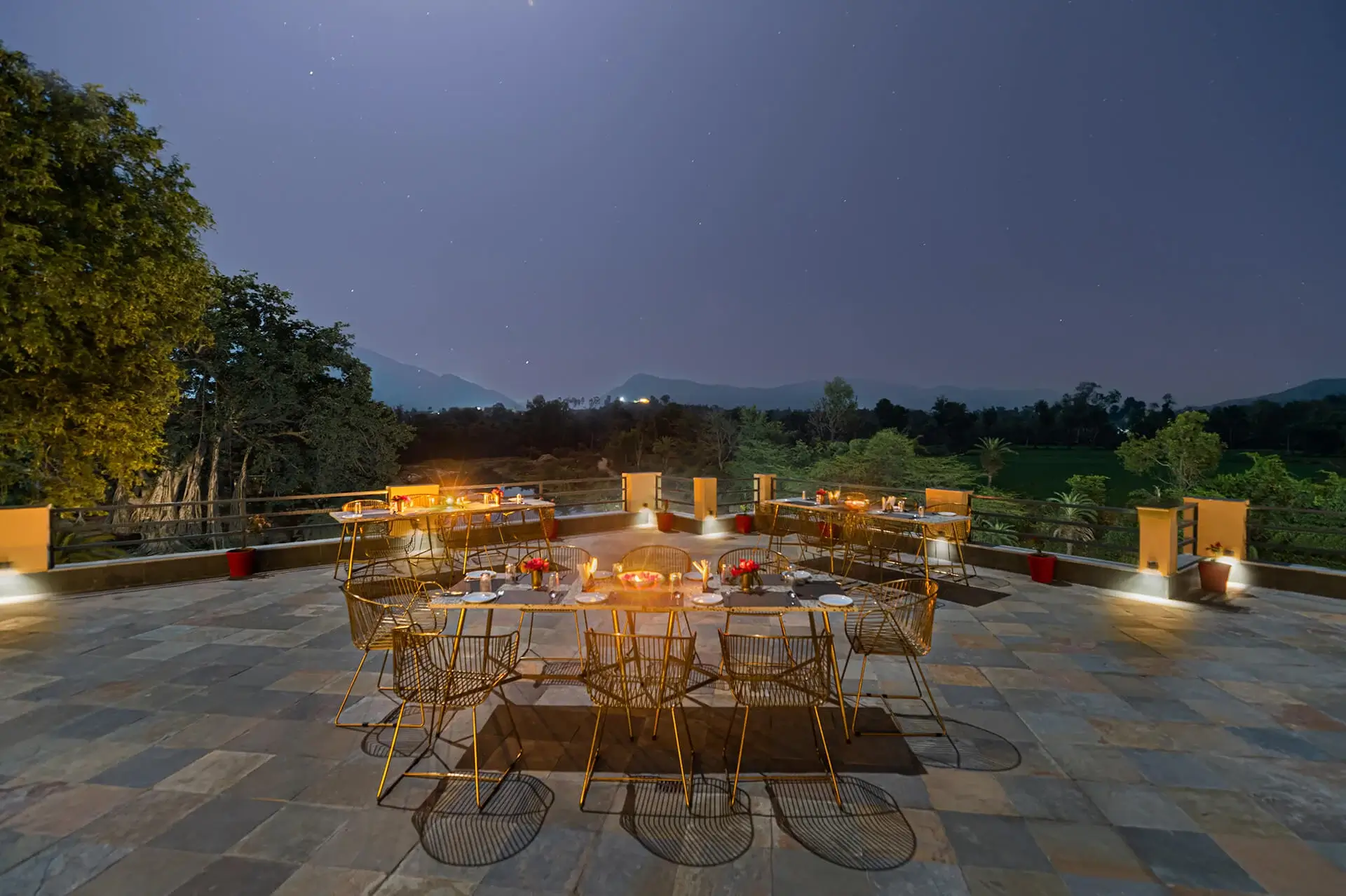 Jhadol Bagh A Pool Deck with Candle Light Dining set up